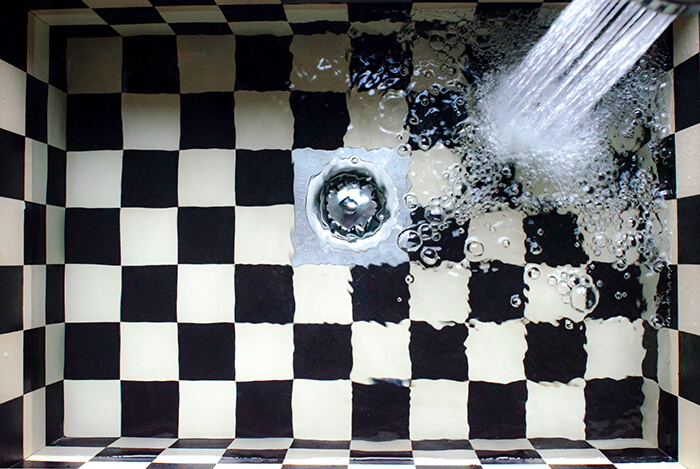 black and white checked bath tub plumbing maintenance